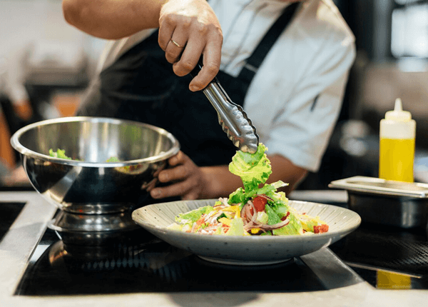 chef preparing a salad
